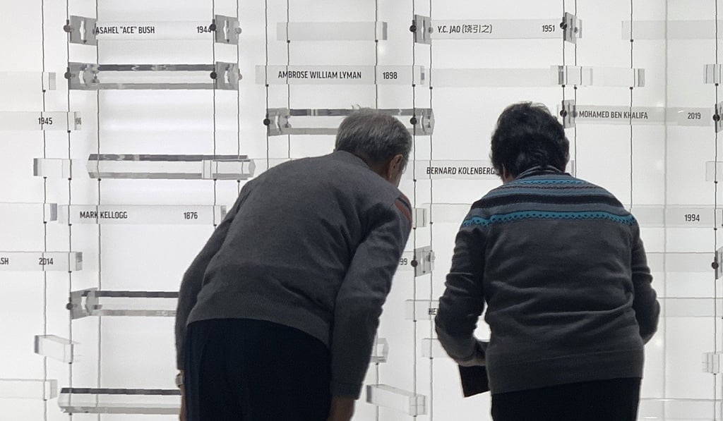 Children of former Associated Press journalist YC Jao bow as their father’s name is added to AP’s memorial Wall of Honour in New York on Wednesday. Photo: AP Children of former Associated Press journalist YC Jao bow as their father’s name is added to AP’s memorial Wall of Honour in New York on Wednesday. Photo: AP