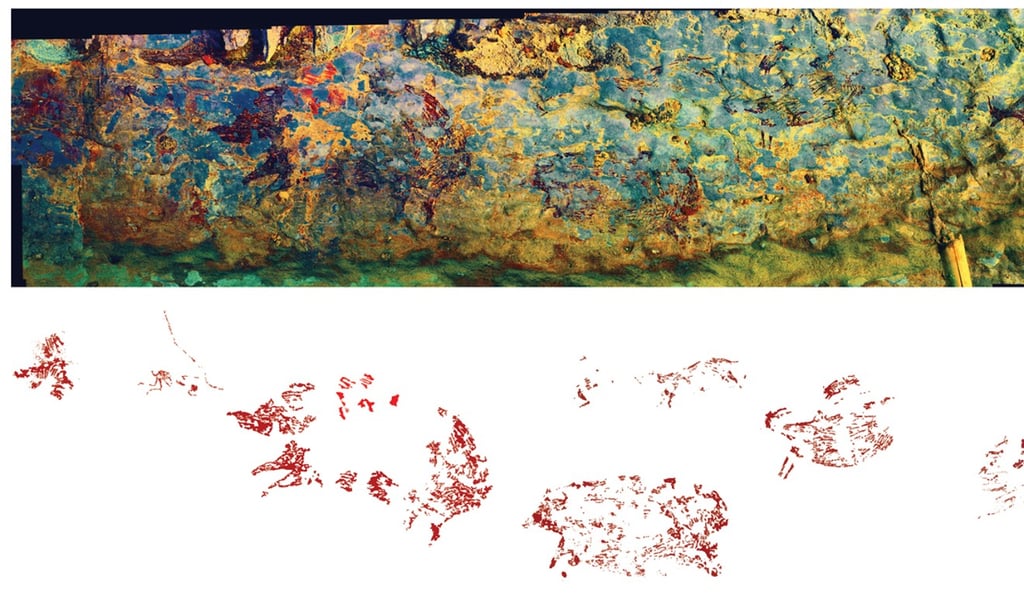 A photo-stitched panorama of the scene at the Sulawesi cave in Indonesia. On the far right, small humanlike figures confront an animal. Photo: Adam Brumm/Ratno Sardi/Adhi Agus Oktaviana A photo-stitched panorama of the scene at the Sulawesi cave in Indonesia. On the far right, small humanlike figures confront an animal. Photo: Adam Brumm/Ratno Sardi/Adhi Agus Oktaviana