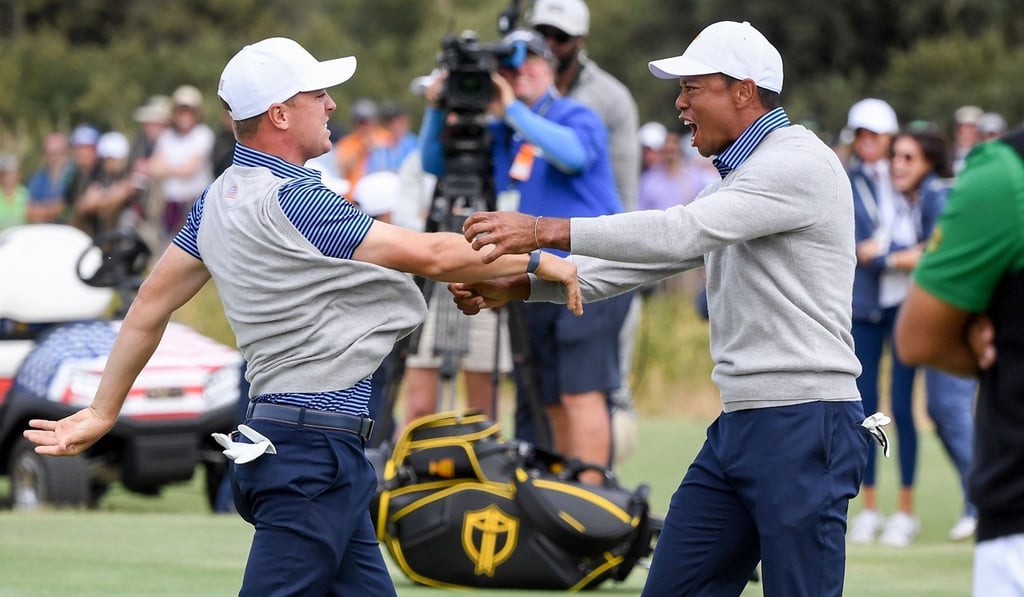 Justin Thomas (left) and Tiger Woods celebrate winning their match during the second day of the Presidents Cup. Photo: AFP Justin Thomas (left) and Tiger Woods celebrate winning their match during the second day of the Presidents Cup. Photo: AFP