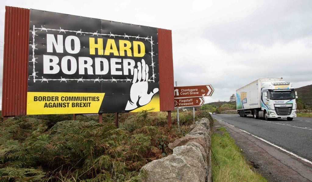A truck passes an anti-Brexit pro-Irish unity billboard on the border between Newry in Northern Ireland and Dundalk in the Irish Republic. Photo: AFP