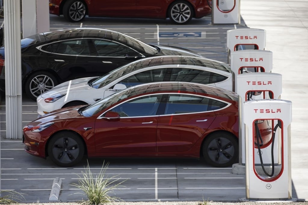 Tesla Model 3 electric cars line up at a Tesla supercharger station in Kettleman City, California, last July. Electric vehicles have been adopted rapidly in California, compared to the rest of the US, accounting for about 44 per cent of total sales last year. Photo: Bloomberg