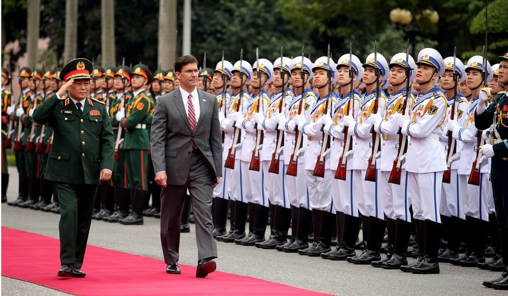 Vietnam’s Minister of National Defence Ngo Xuan Lich welcomes US Secretary of Defence Mark Esper to Hanoi. Photo: EPA