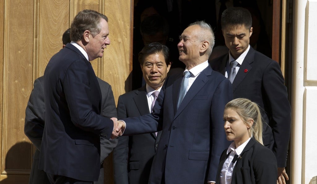 Chinese Vice-Premier Liu He, right, shaking hands with Lighthizer in Washington in October. Photo: AP