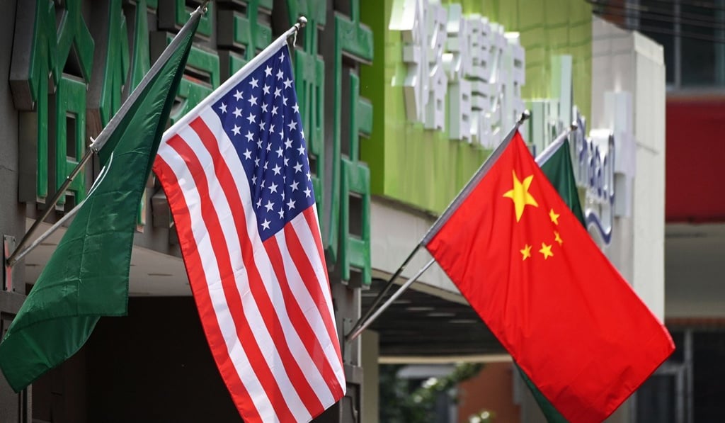The US and Chinese flags displayed outside a hotel in Beijing. Photo: AFP