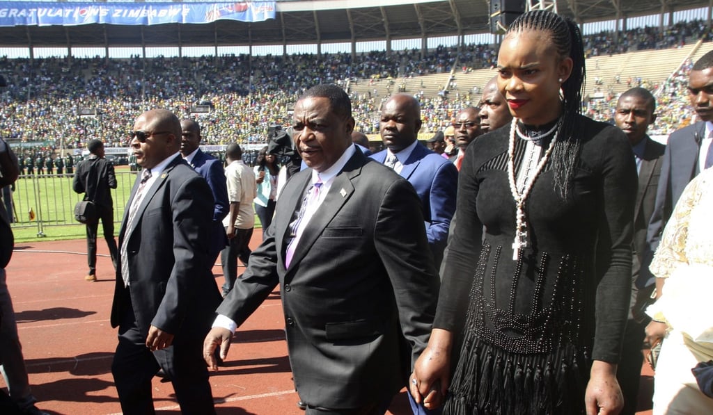 Constantino Chiwenga is seen with his wife Marry (at right) upon arrival for the inauguration ceremony last year of Zimbabwe President Emmerson Mnangagwa, at the National Sports Stadium in Harare. Photo: AP