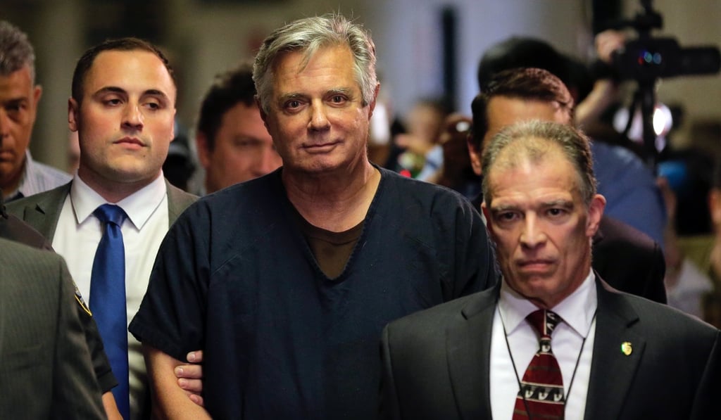 Paul Manafort (centre) arrives in a New York court in June. The former Trump campaign manager has reportedly been hospitalised during his federal prison sentence. Photo: AP