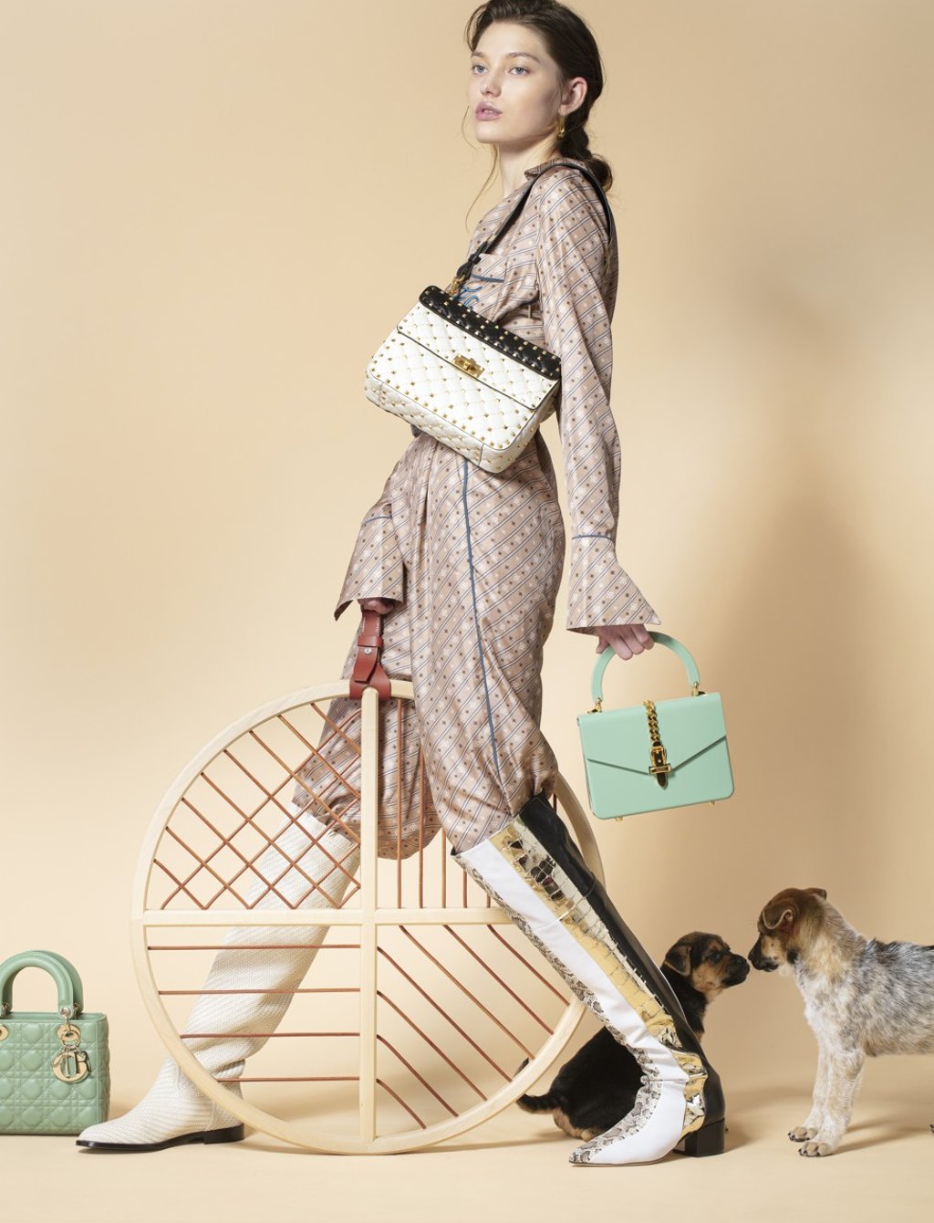 Fendi jumpsuit, HK$26,800; Bottega Veneta earrings, price on request; Valentino white bag (over shoulder), HK$23,500; Gucci green bag (in hand), HK$25,500; Sergio Rossi boot (left leg), HK$16,900; Dior boot (right leg), HK$19,700; (on set) Dior green bag, HK$30,500; Hermès Dreamcatcher, HK$70,700