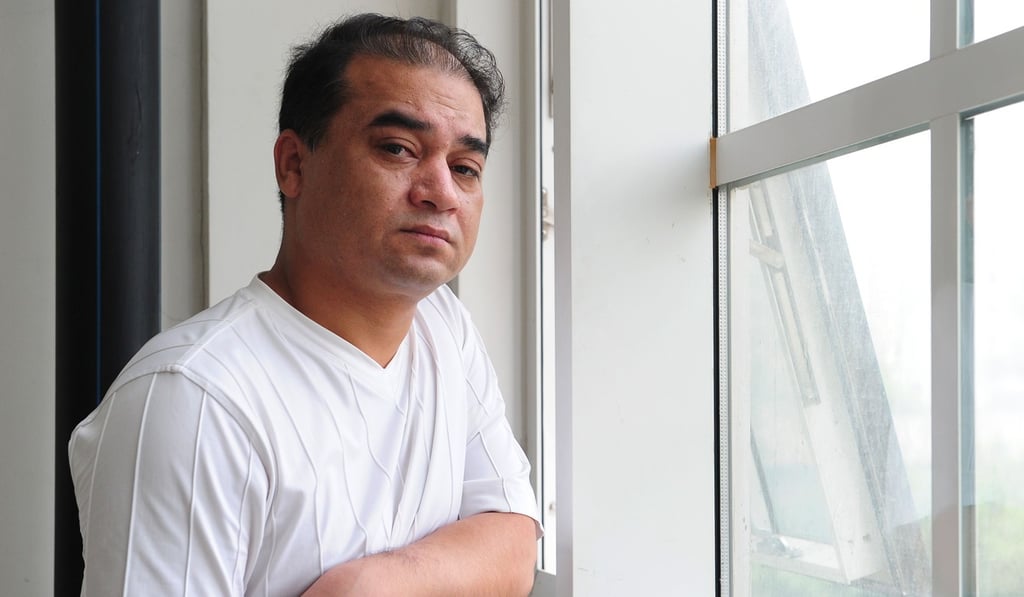 Uygur dissident Ilham Tohti in a Beijing classroom before a giving a lecture in June 2010. Photo: AFP