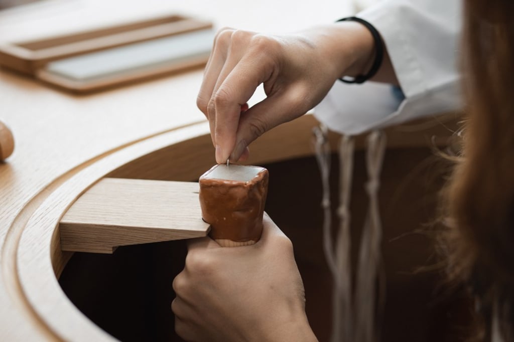 Trying out jeweller techniques in savoir faire courses at L'Ecole Asia-Pacific.