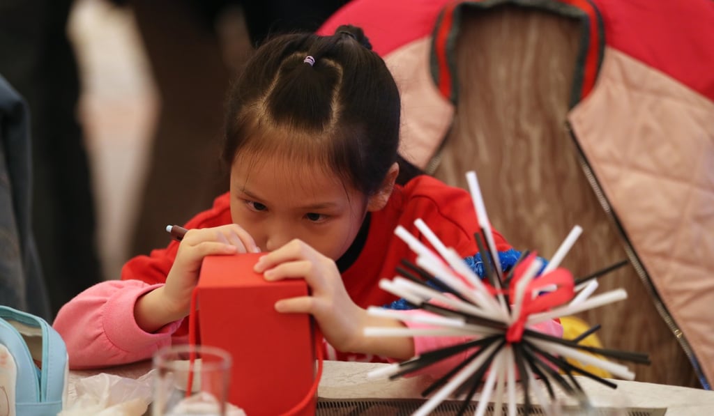 The children created decoration pieces with unused plastic straws at a Christmas party hosted at L’hotel Nina et Convention Centre in Tsuen Wan on December 8. Photo: Edward Wong