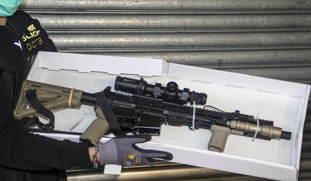 Police displaying the seized rifle. Photo: Handout