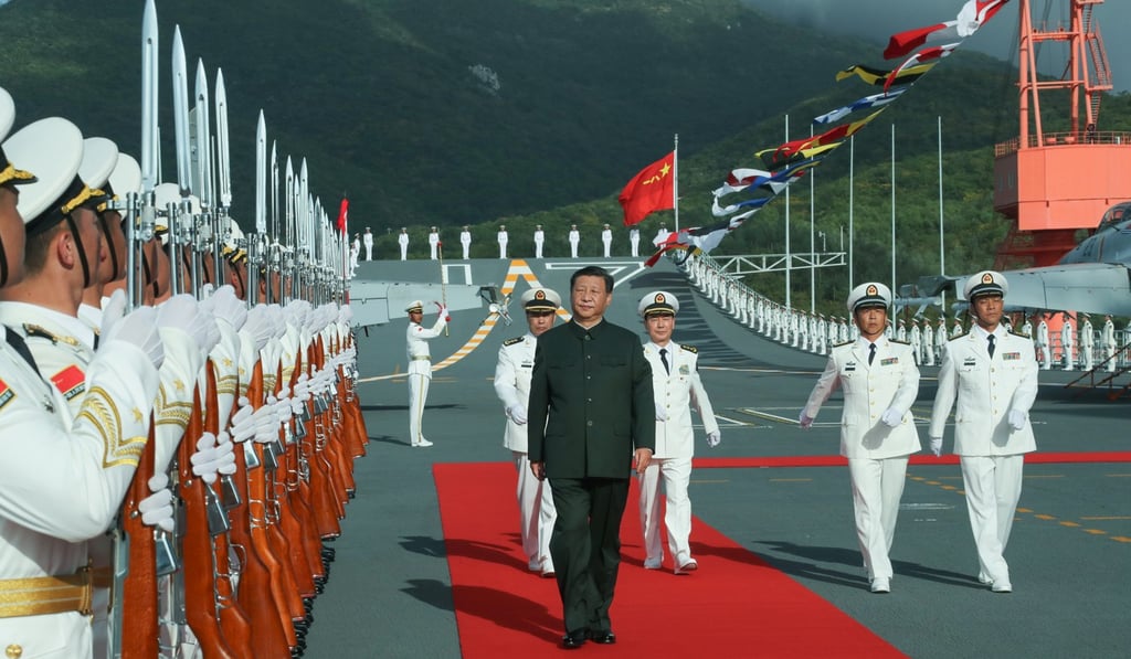 Chinese President Xi Jinping boards the new aircraft carrier Shandong. Photo: Xinhua