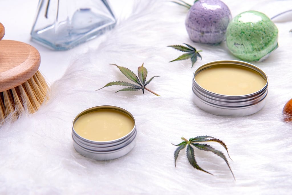 An assortment of cannabis topicals with bath bombs and marijuana salve. Although absorbed by the skin, they won’t give you a high. Photo: Shutterstock