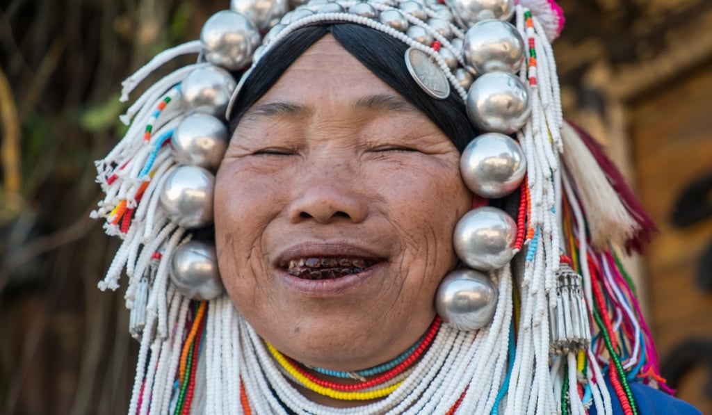 This Akha lady charmed the writer with her blushes, laughter, and betel-nut-stained grin in Mae Salong. Photo: Steve Thomas This Akha lady charmed the writer with her blushes, laughter, and betel-nut-stained grin in Mae Salong. Photo: Steve Thomas