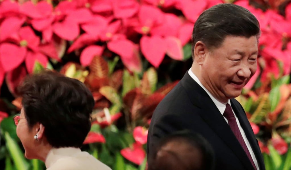 Hong Kong Chief Executive Carrie Lam and (right) Chinese President Xi Jinping attend a ceremony to inaugurate the next administration of the Macau Special Administrative Region and to celebrate the 20th anniversary of the casino hub’s return to China, in Macau on December 20. Photo: Reuters Hong Kong Chief Executive Carrie Lam and (right) Chinese President Xi Jinping attend a ceremony to inaugurate the next administration of the Macau Special Administrative Region and to celebrate the 20th anniversary of the casino hub’s return to China, in Macau on December 20. Photo: Reuters