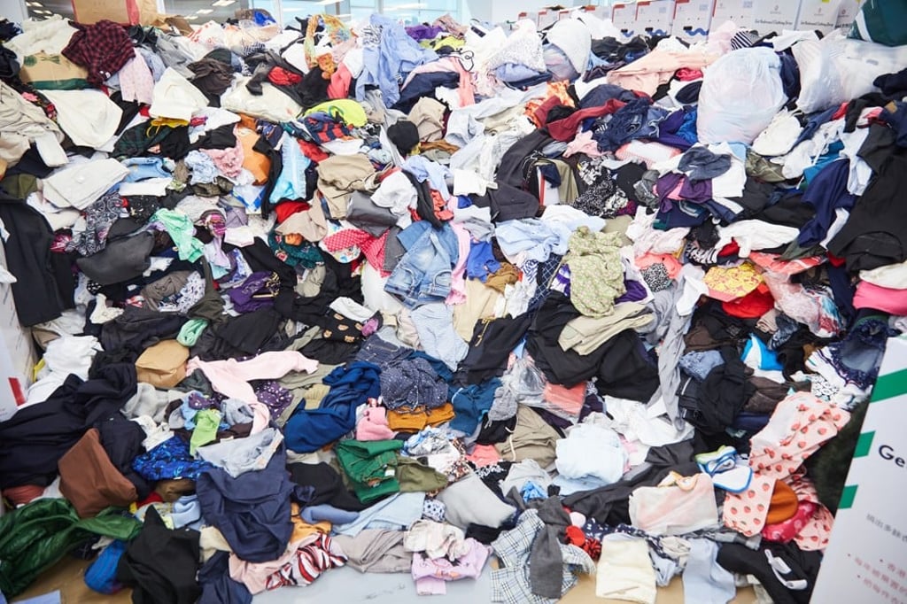 After collecting 15.4 tonnes of unwanted clothes in October, NGO Redress rallied 500 volunteers to help sort and redistribute the clothes last month. Photo: Courtesy of Alex Macro