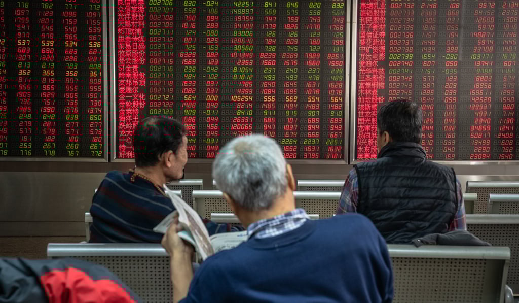 Investors at a securities brokerage in Beijing, China. Photo: EPA