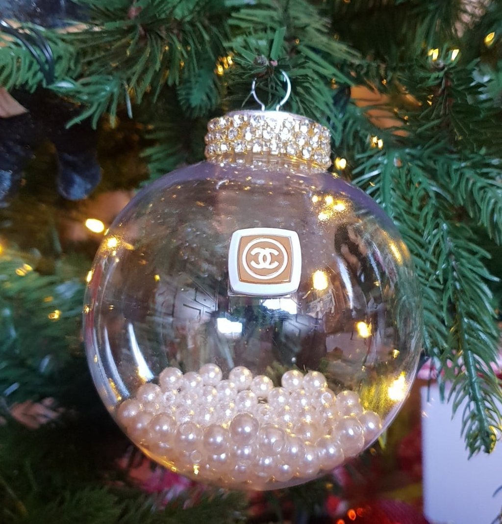 An upcycled Chanel button and Chanel pearls inside a decadent Christmas tree ornament An upcycled Chanel button and Chanel pearls inside a decadent Christmas tree ornament