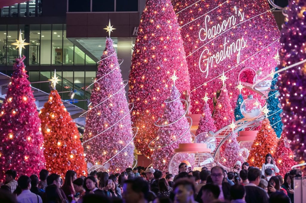 People walk past festive Christmas decorations near Harbour City shopping centre in Tsim Sha Tsui. Hong Kong’s retail and toursim sectors have been hit hard by the lingering anti-government protests. Photo: Bloomberg People walk past festive Christmas decorations near Harbour City shopping centre in Tsim Sha Tsui. Hong Kong’s retail and toursim sectors have been hit hard by the lingering anti-government protests. Photo: Bloomberg