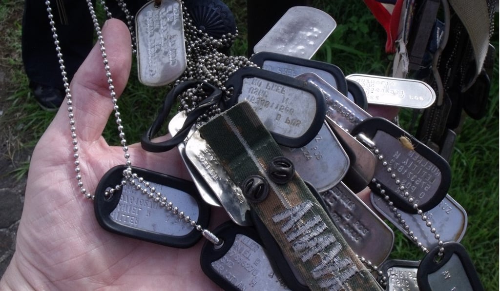 Identification tags left by US marines who have gone to Mount Suribachi to remember lost soldiers. Photo: Julian Ryall Identification tags left by US marines who have gone to Mount Suribachi to remember lost soldiers. Photo: Julian Ryall