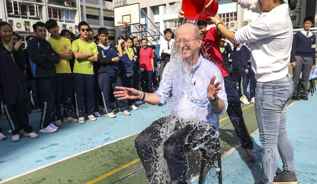 Teacher John Guest says he volunteered to get wet. Photo: Dickson Lee