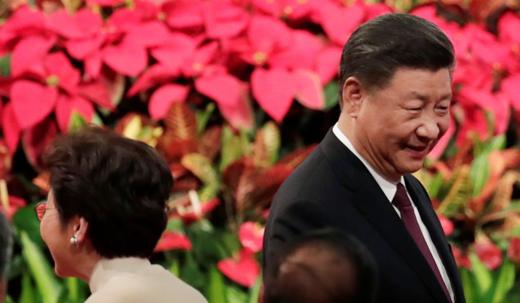 Chinese President Xi Jinping and Hong Kong Chief Executive Carrie Lam attend a ceremony in Macau on December 20 to celebrate the 20th anniversary of the casino hub’s return to China. Photo: Reuters