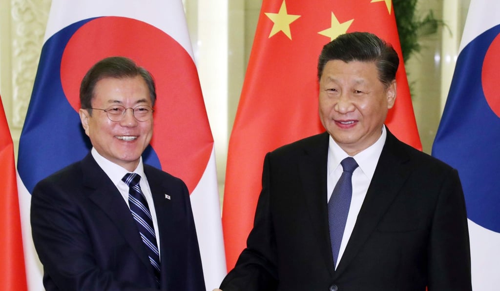 South Korea's President Moon Jae-in, left, and China's President Xi Jinping in Beijing on December 23. Photo: AFP South Korea's President Moon Jae-in, left, and China's President Xi Jinping in Beijing on December 23. Photo: AFP