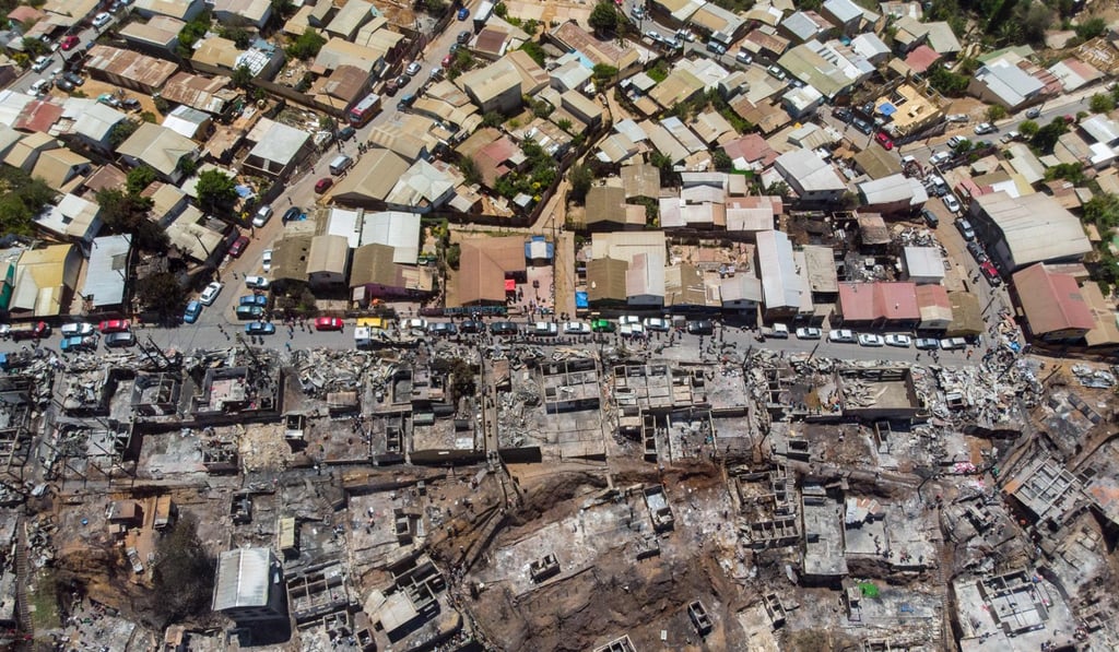 An aerial view on Wednesday of houses that burned in a fire at Rocuant hill in Valparaiso, Chile. Photo: AFP An aerial view on Wednesday of houses that burned in a fire at Rocuant hill in Valparaiso, Chile. Photo: AFP