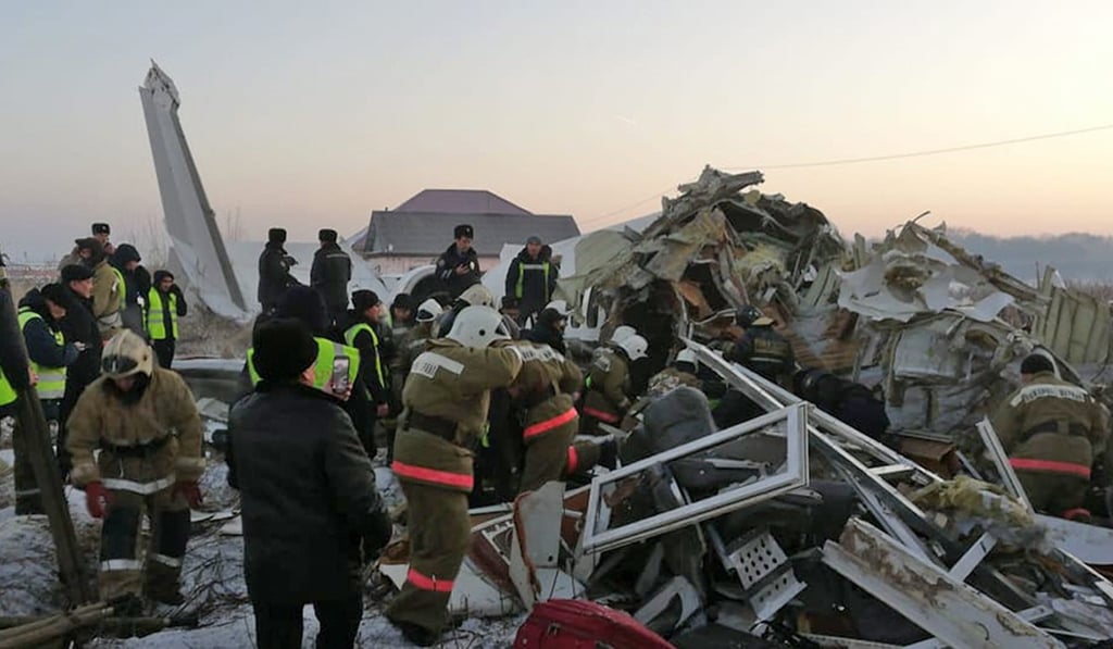 Rescuers work on the site of a plane crash near Almaty International Airport. Photo: Kazakhstan Emergency Situations Ministry via AP Rescuers work on the site of a plane crash near Almaty International Airport. Photo: Kazakhstan Emergency Situations Ministry via AP