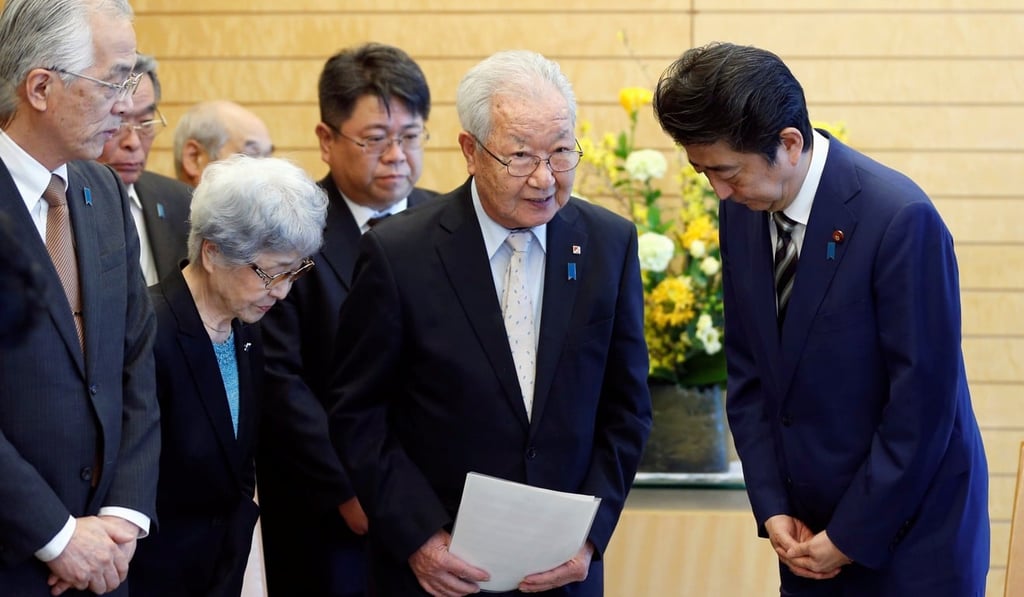 Japan's Prime Minister Shinzo Abe (right) meets Shigeo Iizuka (centre), leader of a group of families of Japanese abducted by North Korea, and Sakie Yokota, mother of Megumi Yokota, one of the abductees, in Tokyo in March 2018. Photo: Reuters