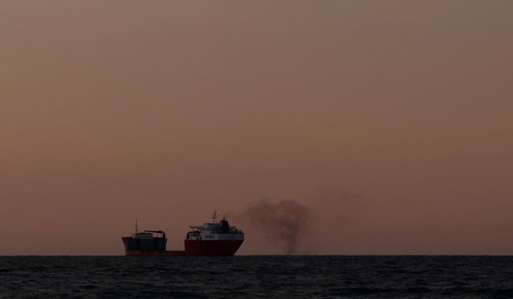 Smoke is blown from a cargo ship at sea. Photo: Reuters Smoke is blown from a cargo ship at sea. Photo: Reuters