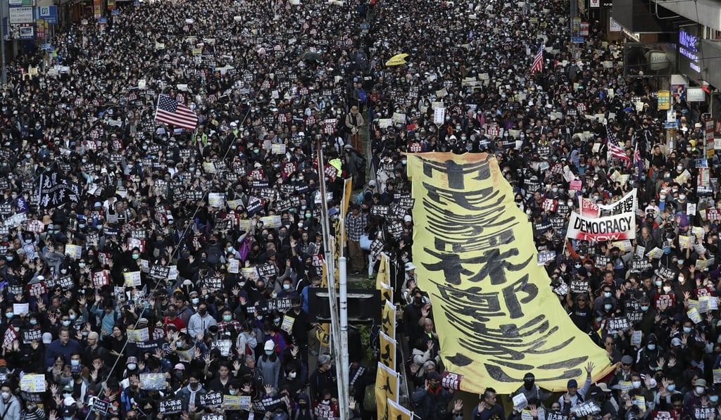 Anti-government protestors march from Causeway Bay to Central on the eve of the six month anniversary of the social unrest. Photo: Robert Ng