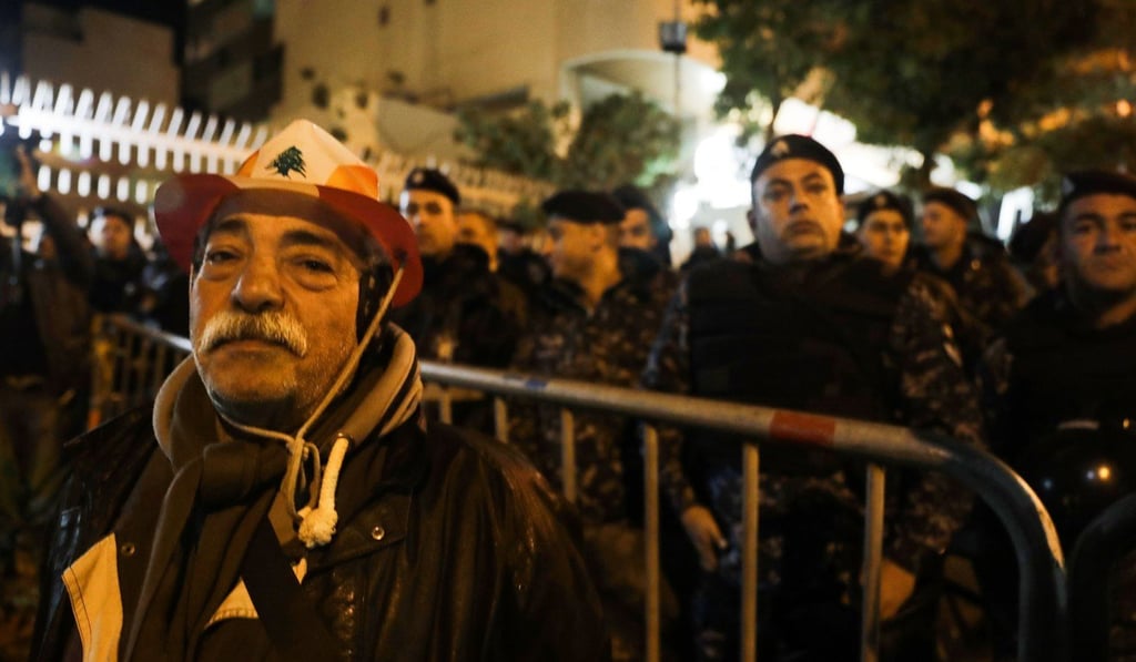 An elderly man takes part in a protest outside the house of Lebanon's new prime minister in the capital Beirut. Photo: AFP