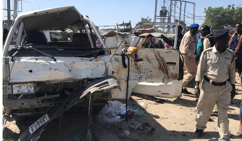 Somali security officials assess the scene of a car bomb explosion in Mogadishu. Photo: Reuters Somali security officials assess the scene of a car bomb explosion in Mogadishu. Photo: Reuters