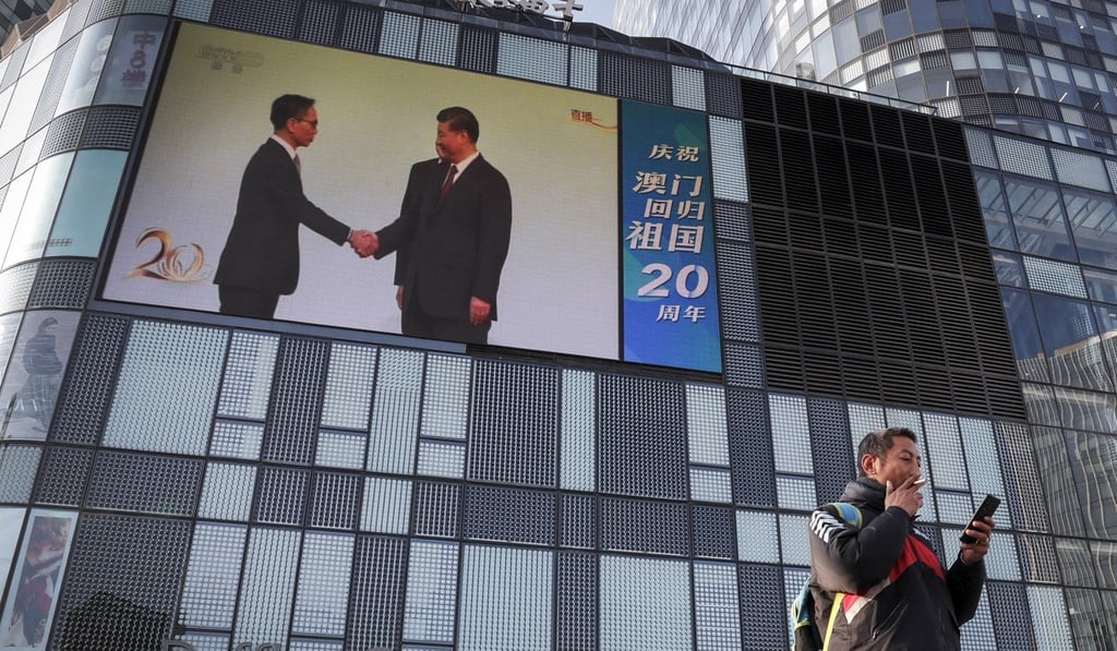 Chinese President Xi Jinping congratulates a newly elected Macau official during an inauguration ceremony for the 20th anniversary of Macau’s handover on December 20, 2019. Photo: AP