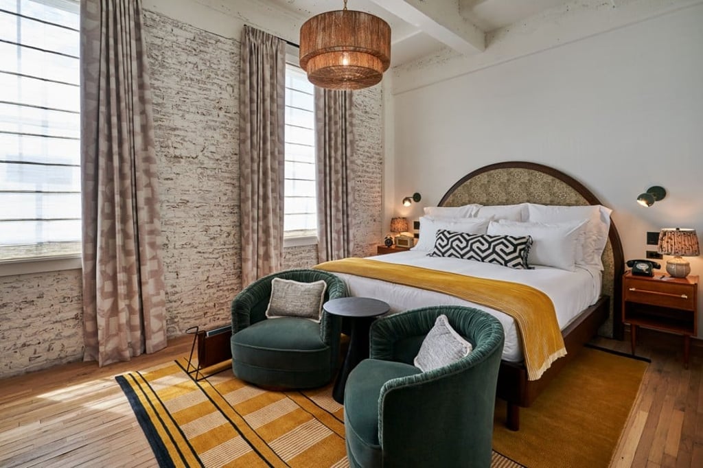 The ‘Cosy’ room at the club’s hotel features exposed brickwork and 1970-style furnishings. The ‘Cosy’ room at the club’s hotel features exposed brickwork and 1970-style furnishings.