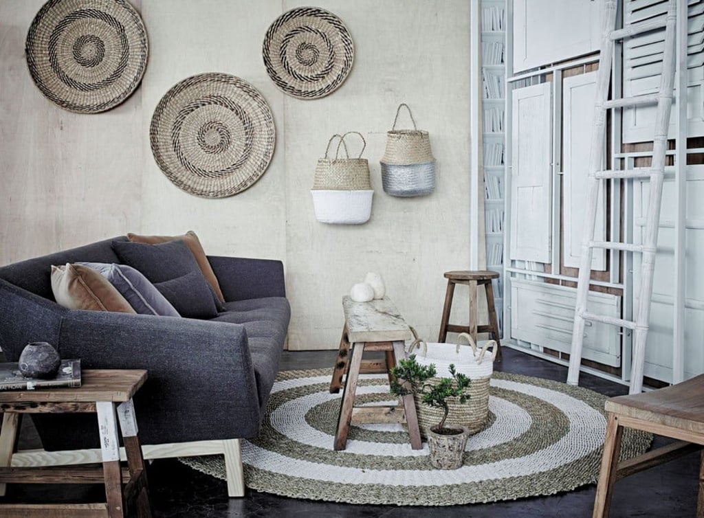A wabi-sabi boat wood bench, terracotta ceramics and handwoven baskets from Tree
