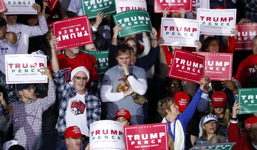 Supporters of US President Donald Trump hold up placards at his campaign rally in Battle Creek, Michigan, on December 18. Trump’s “America first” agenda resonates with significant numbers of the US voting public. Photo: AP Supporters of US President Donald Trump hold up placards at his campaign rally in Battle Creek, Michigan, on December 18. Trump’s “America first” agenda resonates with significant numbers of the US voting public. Photo: AP
