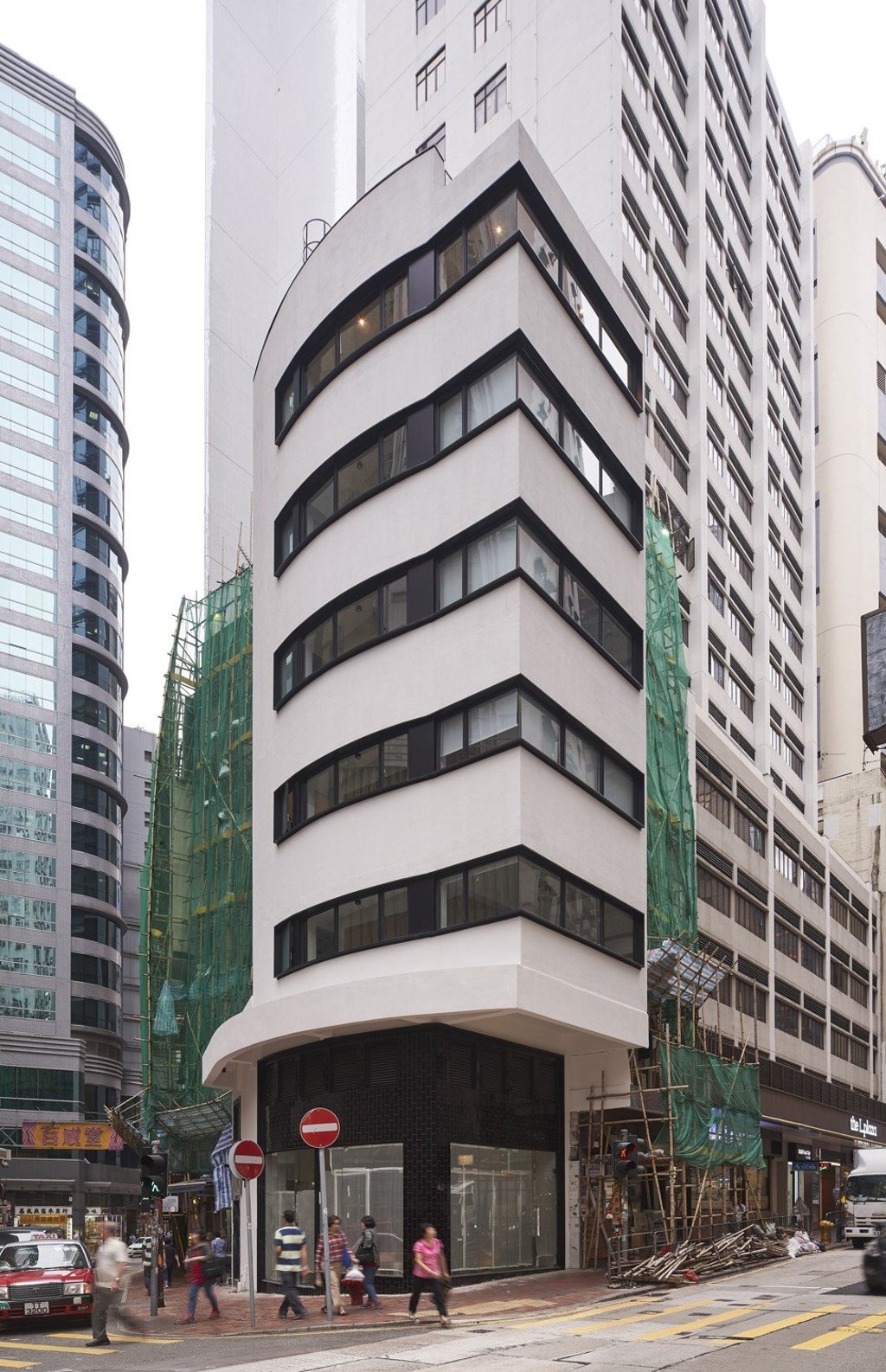 Architects at PMDL turned this tenement at 379 Queen's Road Central into five floors of compact, serviced apartments. Photo: PMDL