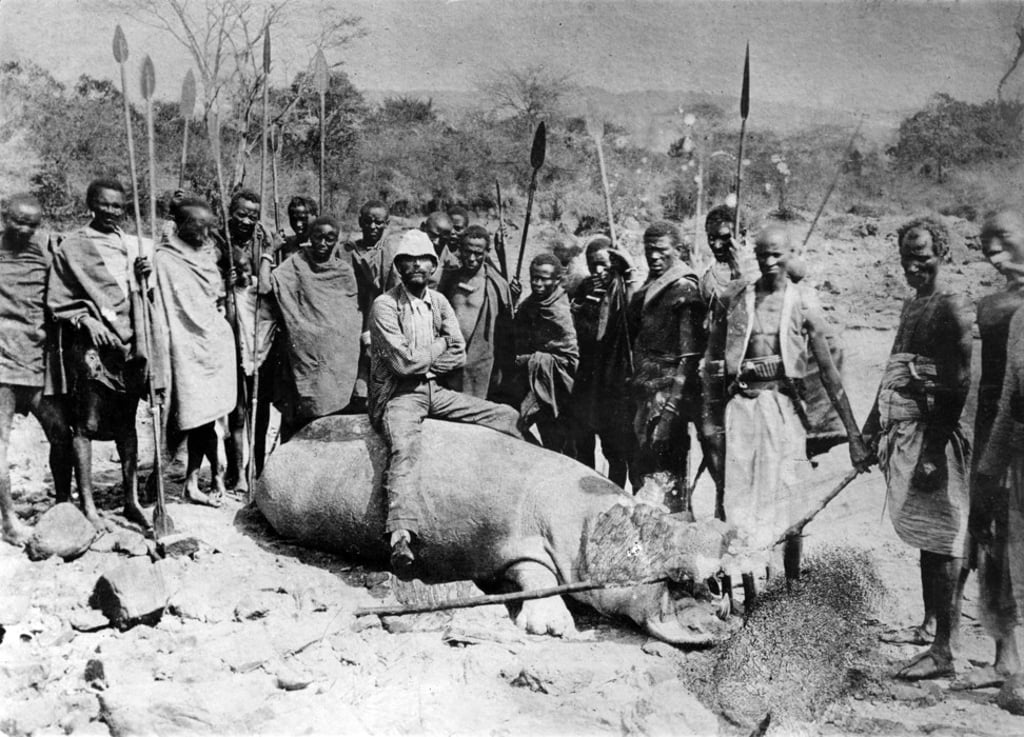 An Italian explorer poses on a hippopotamus surrounded by local hunters in Ethiopia, in the 1890s. Photo: Getty Images An Italian explorer poses on a hippopotamus surrounded by local hunters in Ethiopia, in the 1890s. Photo: Getty Images