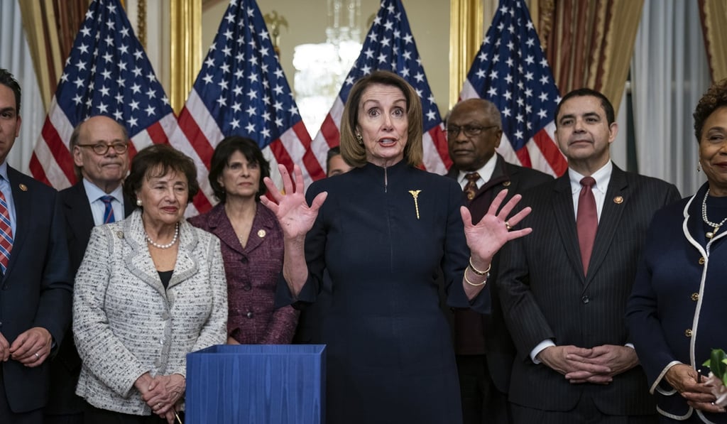 Speaker of the US House of Representatives Nancy Pelosi gestures after signing a US$328 billion spending bill to prevent another government shutdown, in Washington last February. Photo: EPA-EFE