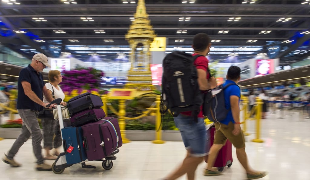 Travellers at Suvarnabhumi airport in Bangkok, which dropped out of the world’s top 10 for on-time performance. Photo: AFP