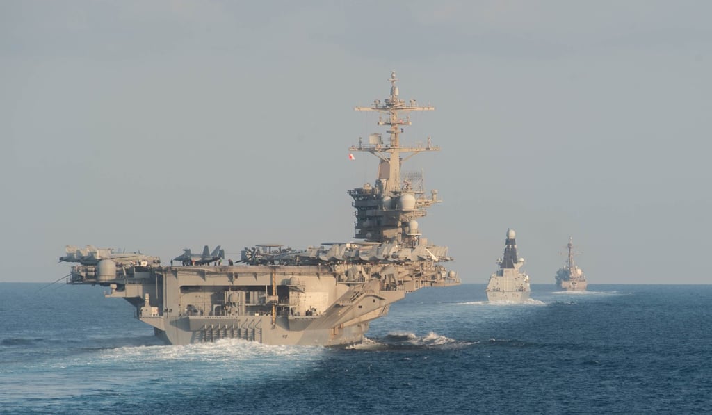 The US aircraft carrier USS Abraham Lincoln, the UK’s HMS Defender and the guided-missile destroyer USS Farragut transit the Strait of Hormuz in late 2019. File photo: AFP