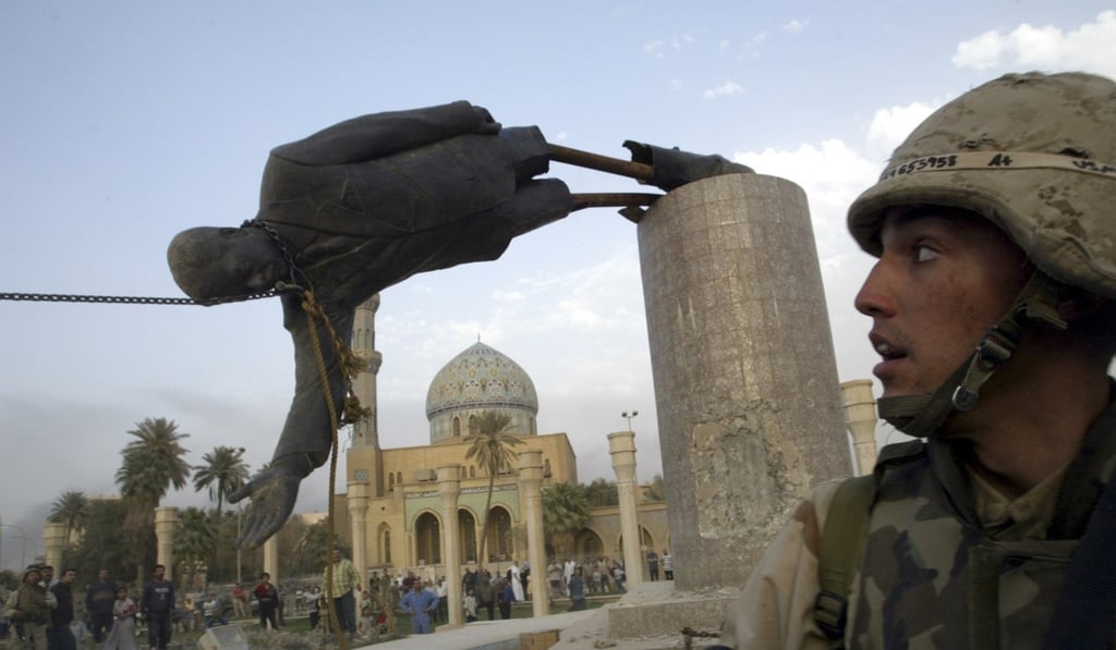 A US Marine watches as a statue of Iraq’s president Saddam Hussein falls in central Baghdad on April 9, 2003. The US invasion of Iraq set off a series of events that plunged the region into conflict and can be tied to the rise of extremist groups such as Islamic State. Photo: Reuters