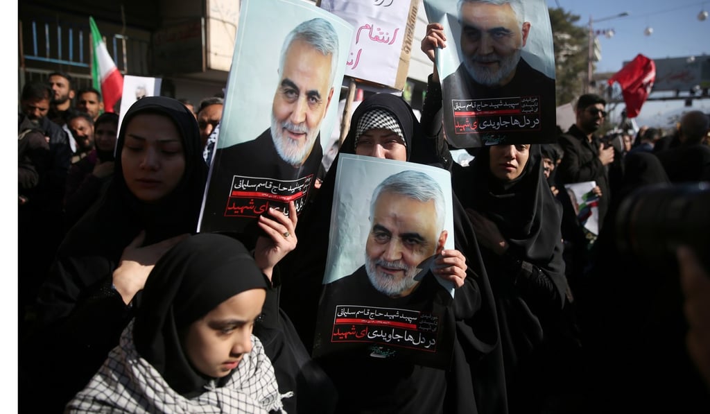 Mourners hold pictures of Iranian military commander Qassem Soleimani during his funeral procession in Kerman, Iran. Photo: Reuters Mourners hold pictures of Iranian military commander Qassem Soleimani during his funeral procession in Kerman, Iran. Photo: Reuters