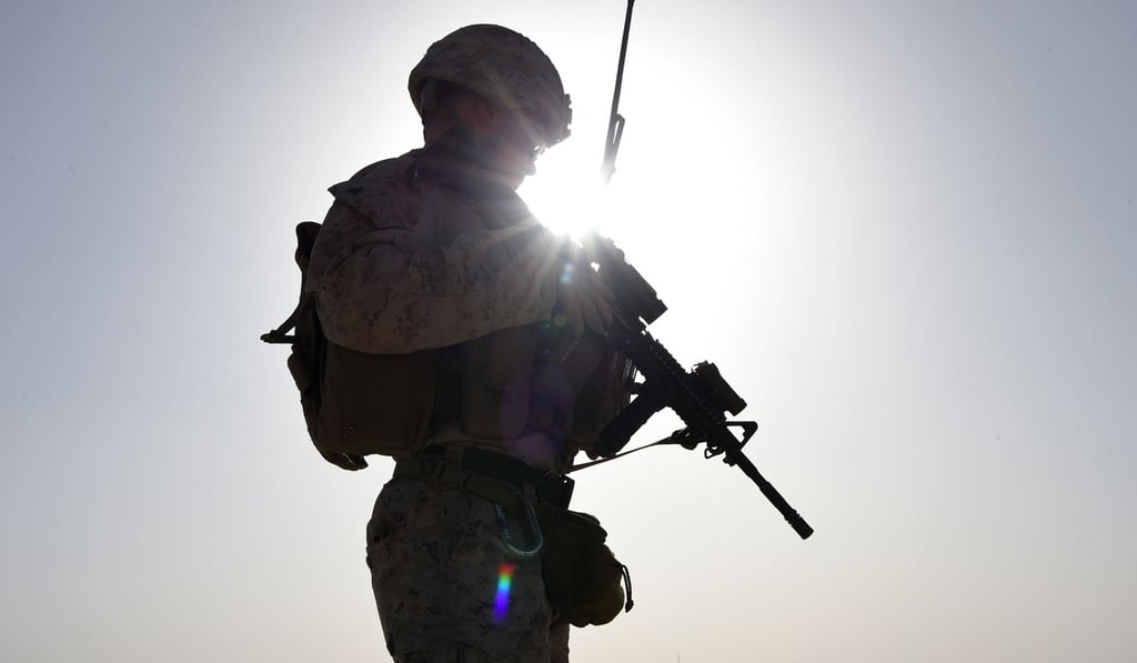 US Marine watches Afghan commandos take part in a combat training exercise. The US military has increased protection of its forces, particularly in Iraq. File photo: AFP
