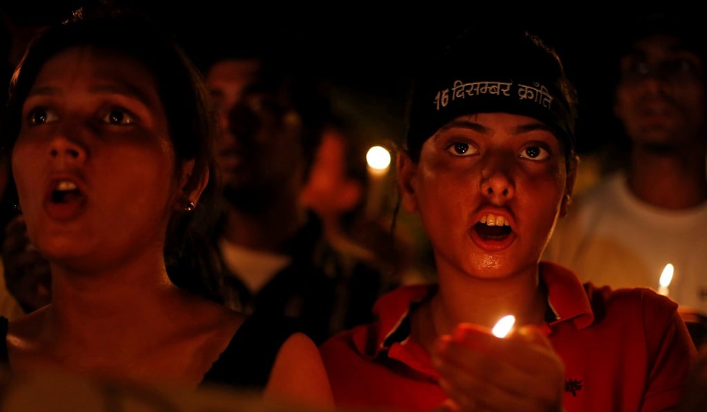 Protesters hold a candlelight vigil after four men convicted of raping and murdering a 23-year-old woman on a bus in New Delhi were sentenced to death. Photo: Reuters Protesters hold a candlelight vigil after four men convicted of raping and murdering a 23-year-old woman on a bus in New Delhi were sentenced to death. Photo: Reuters