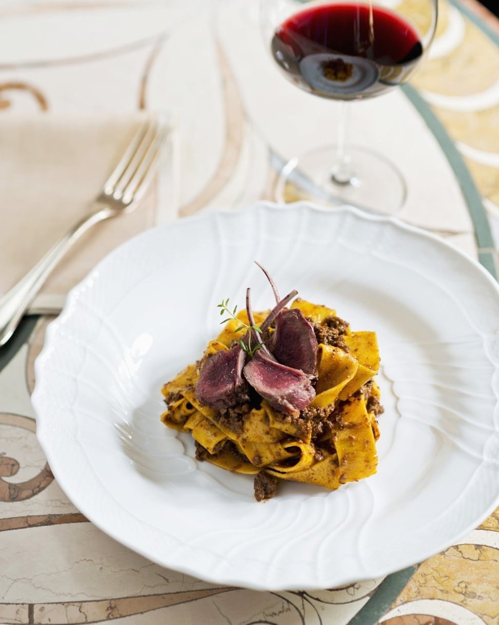 Piccini’s papardelle with chicken ragout and rare hare chops, at Caino, in Tuscany. Photo: Getty Images