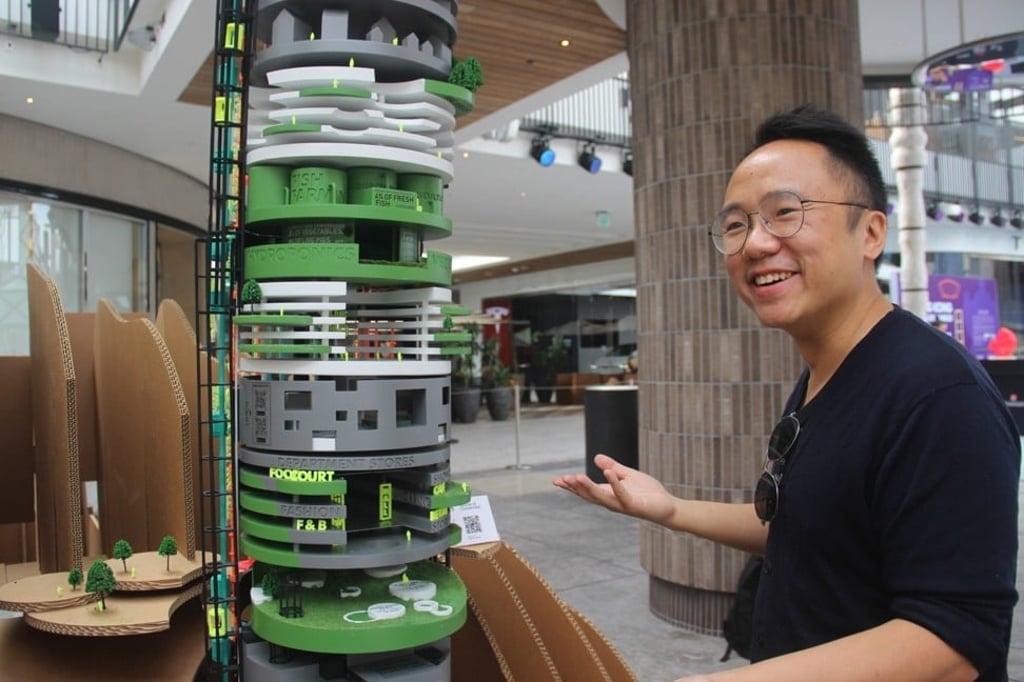 Eric Ho with his installation, “Island of Condensed”, from the “Island_Peninsula” exhibition, in Los Angeles.