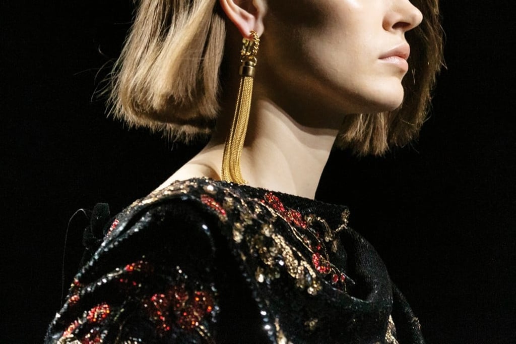 Saint Laurent debuted a severe pair of gold-toned, multichain earrings. Photo: Handout Saint Laurent debuted a severe pair of gold-toned, multichain earrings. Photo: Handout